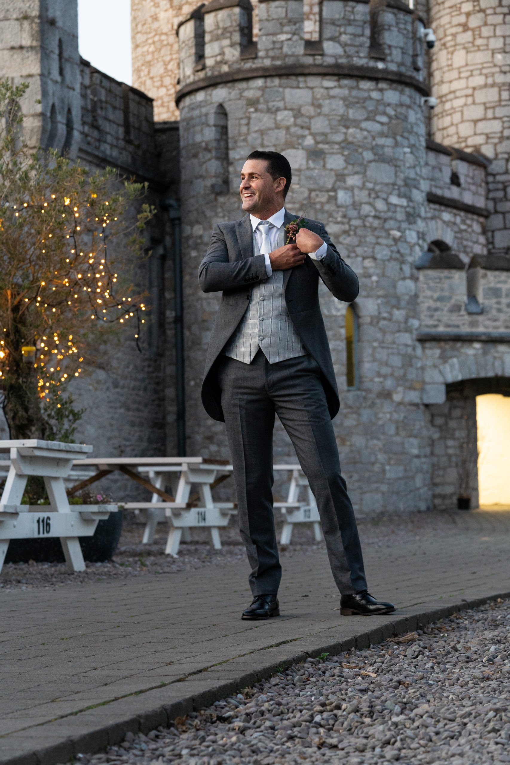 A groom in front of the castle