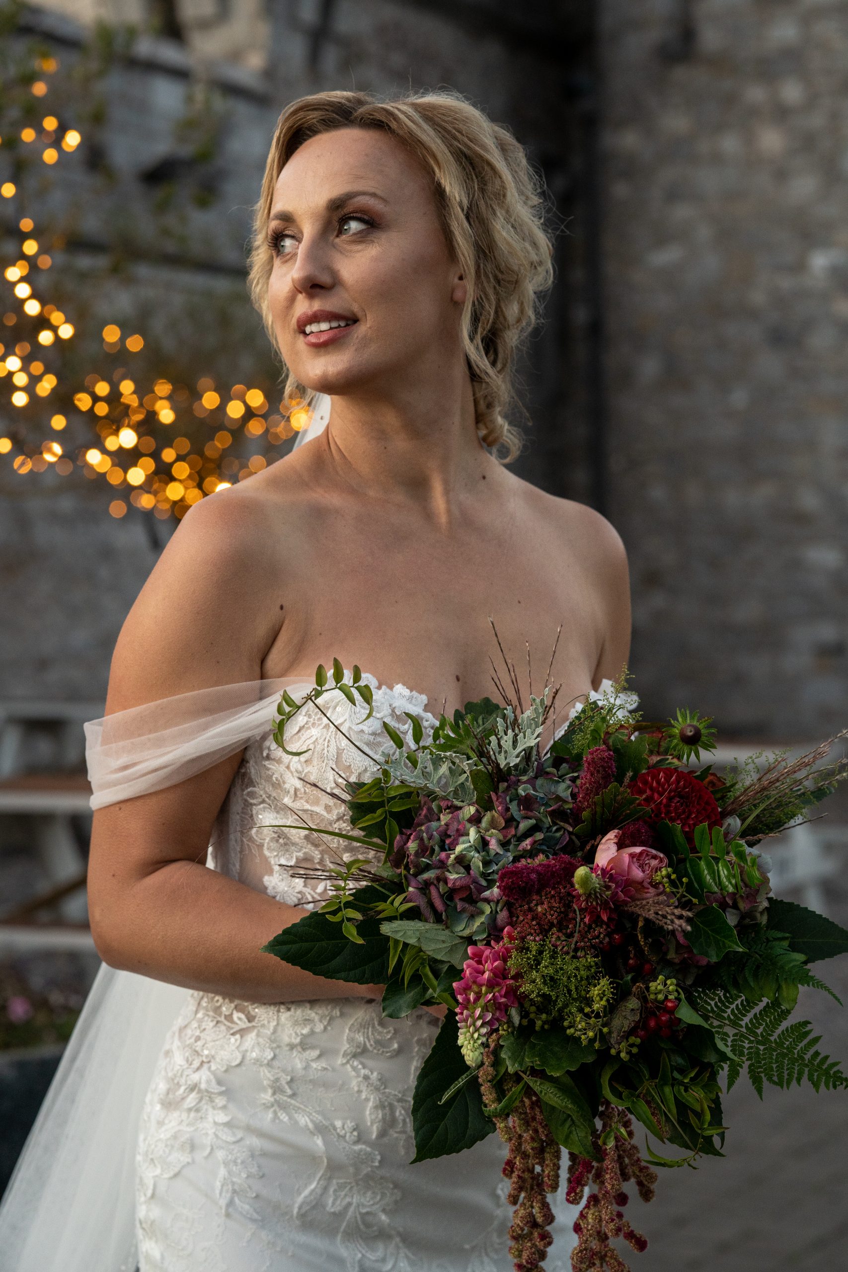 A bride in front of th ecastle